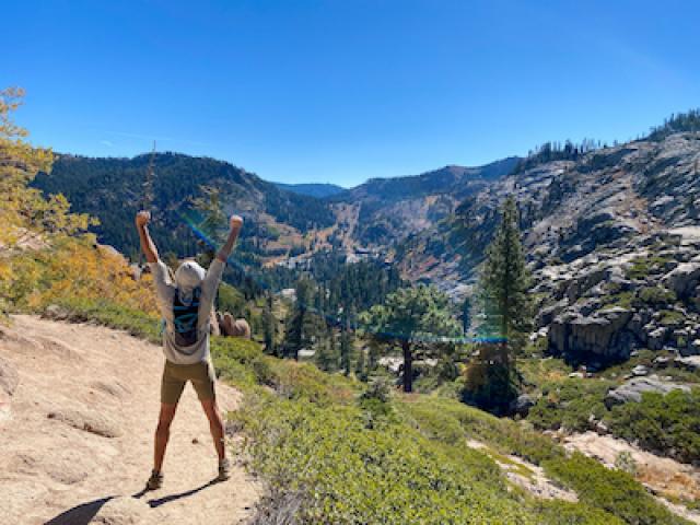 Man with long beard hiking in the California wilderness.