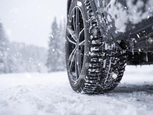 close up of tires on snowy road