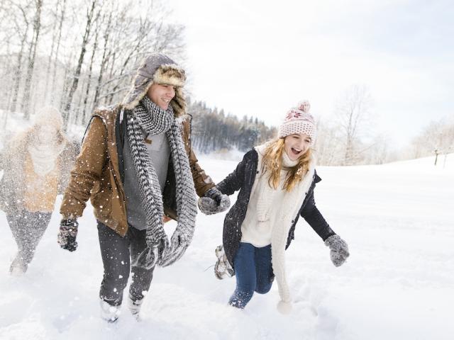 people walking in snow, smiling